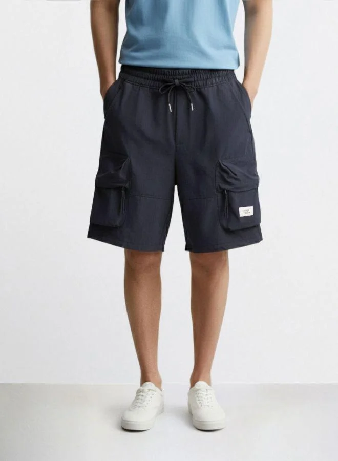 The Indian Garage Co Men Relaxed Fit Solid Cargo Pocket Mid-Rise Cargo Shorts